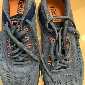 Women nike running shoes. Size 9.5 Semi-used (2x), blue & orange, comfortable